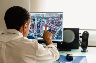 A man touching a computer screen