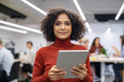 A woman holding a tablet